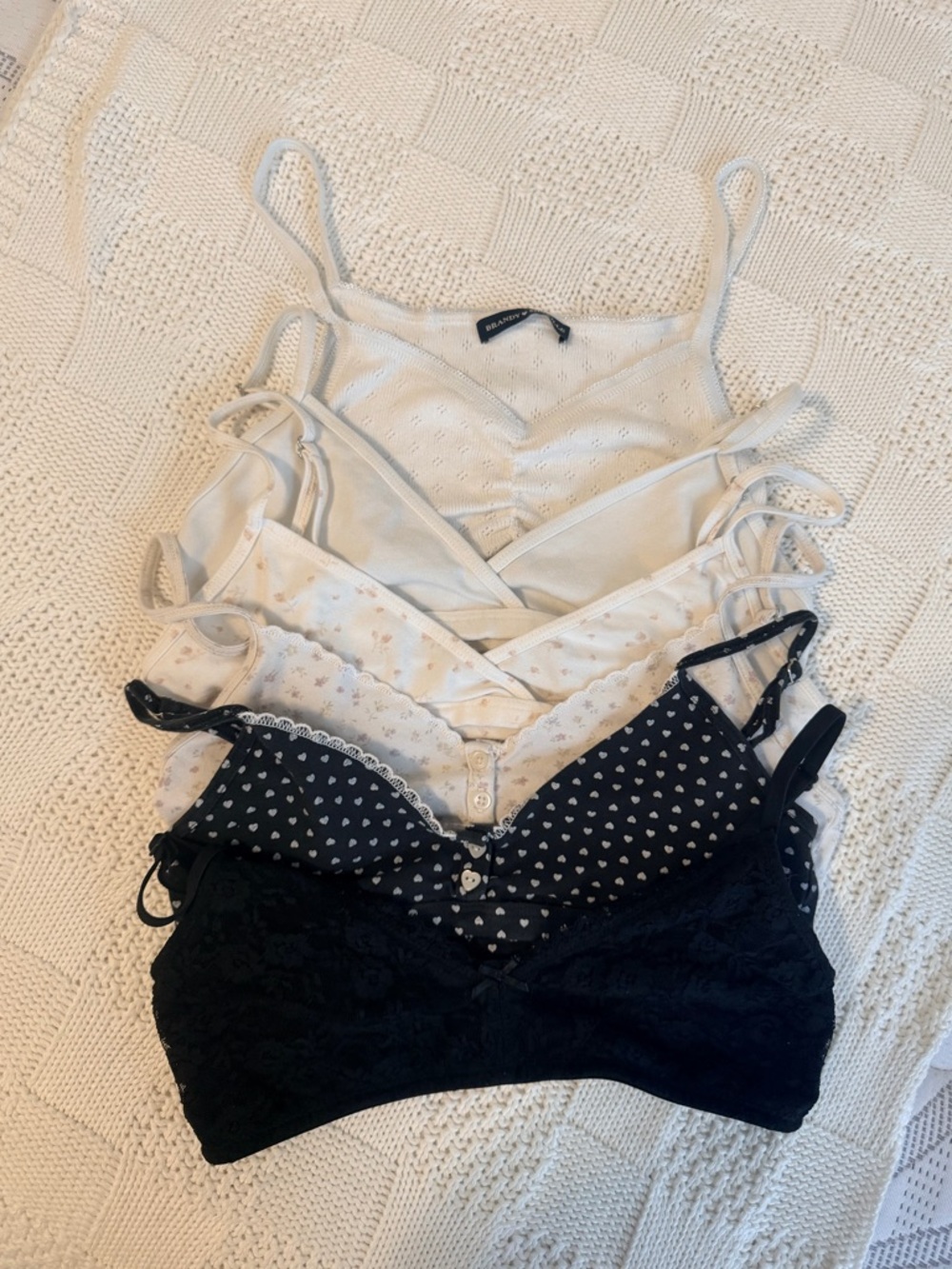 Brandy Melville cream, white, navy and black layered bralette set